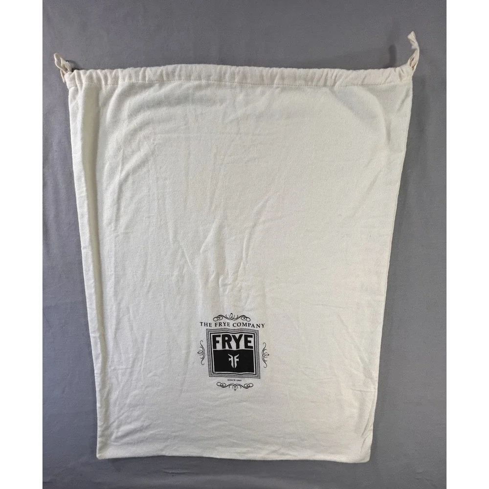 The Frye Company cream-colored cotton dust bag with a drawstring closure boots